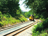 Looking down the "throat" from XNJ's on a hot 2002 Summer Day. A CSX power transfer approaches from the west just passed Bailey Road in Cuyahogger Falls, OH